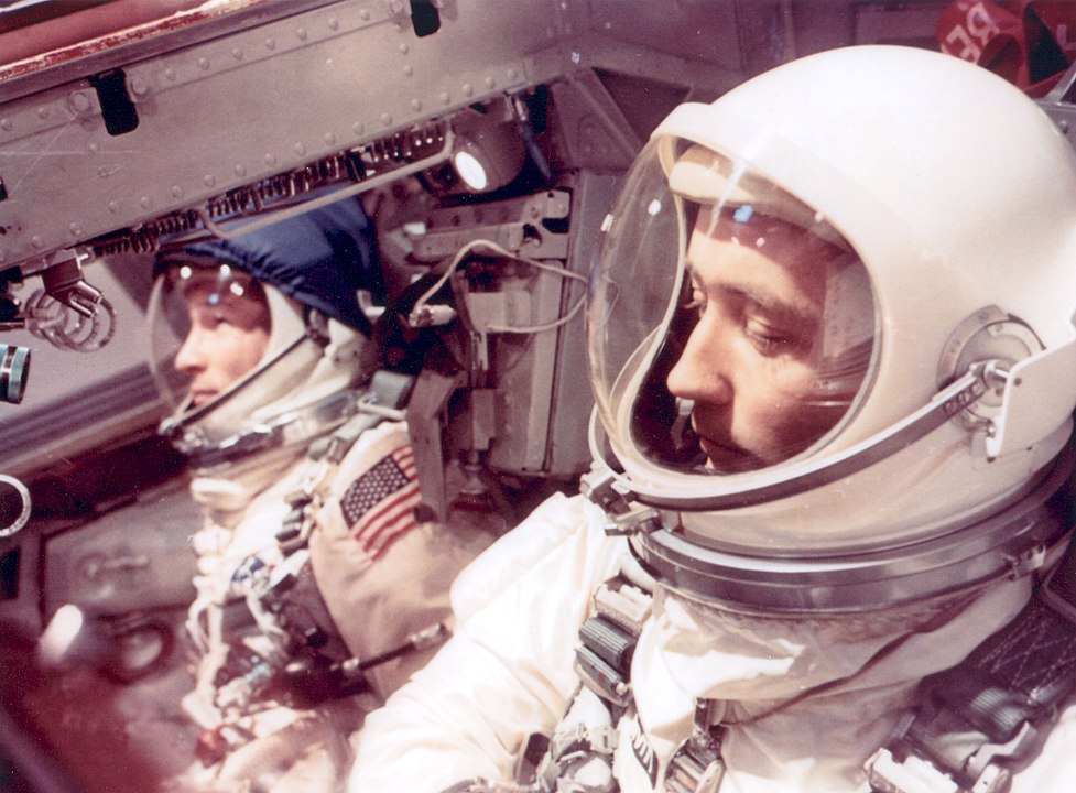 Astronauts White and McDivitt inside the Gemini 4 spacecraft. Those first spacesuits were just modified high-altitude flight suits. Image Credit: By NASA - Great Images in NASA Description, Public Domain, https://commons.wikimedia.org/w/index.php?curid=6458643